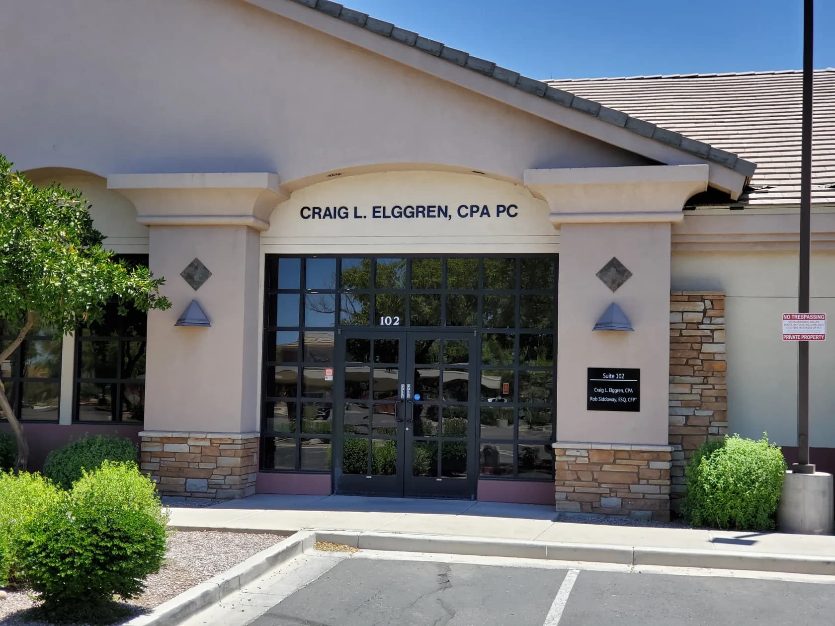 Entrance to Craig L. Elggren, CPA PC, with the firm name and suite 102 above the doors
